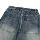 Jean évasé à pampilles effet usé