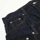 Jean évasé à pampilles effet usé