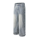 Jean évasé à pampilles effet usé