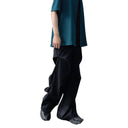 Pantalon ample à plis bruts