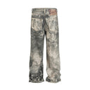 Jean évasé à pampilles effet usé