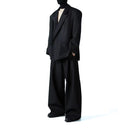 Pantalones holgados con pliegues