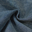 Vaqueros desgastados con borlas y campana