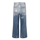 Jean évasé à pampilles effet usé