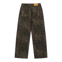 Vaqueros desgastados con borlas y campana