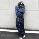 Jean évasé à pampilles effet usé