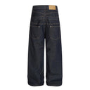 Jean évasé à pampilles effet usé