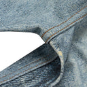 Jean évasé à pampilles effet usé