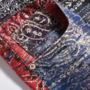 Vaqueros desgastados con estampado paisley índigo