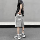 Pantalones cortos cargo de mezclilla desgastada